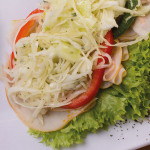 1052 Pute Tandoori: Putenbrust Feinschnitt, Curry, Krautsalat, Paprika, Salat